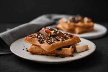 Homemade waffles with fruit and granola..