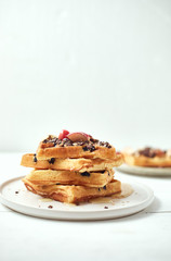 Homemade waffles with fruit and granola..