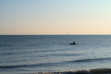 Fototapeta premium fishing at sunset,sea,horizon,water,coast,view,sky