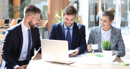 Young startups businessmen teamwork brainstorming meeting to discuss the investment.