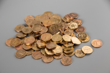 a pile of coins on a gray background