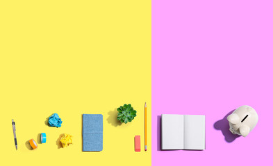 Piggy bank with office supplies from above