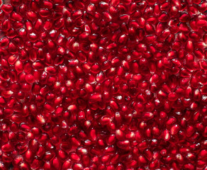 peeled pomegranate seeds, closeup. food or fruit background. selective focus