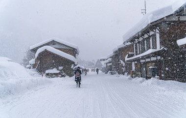 Fototapeta premium The traditionally thatched houses in Shirakawa-go where is the mountain village among near Gifu, Ishikawa, and Toyama prefecture in winter, Japan