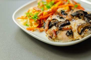 Chicken breast with sliced mushrooms, ham, in cheese sauce with pasta salad