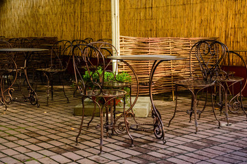 Chairs and tables in a cozy street cafe