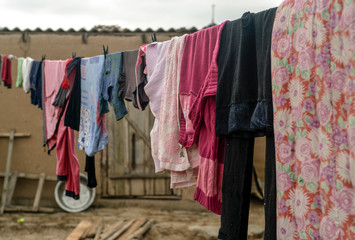 Editorial. Kyrgyzstan. Osh oblast, S. Babulak, 02. 11. 2019. Washed clothes on a hanger outdoors under the sun.