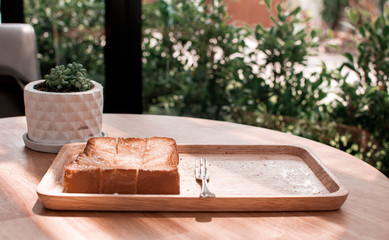 A baked toast with sugar and butter on it