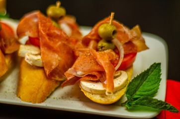 traditional spanish tapas for lunch table, mini sandwiches food set,  delicious snack appetizer