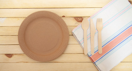 Fototapeta na wymiar Eco paper plate fork on old wooden table