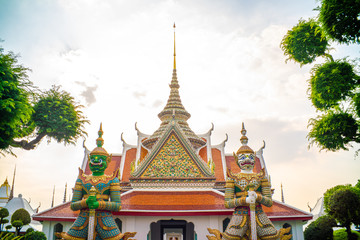 Fototapeta premium Giant stand statue in Wat Arun templeof dawn