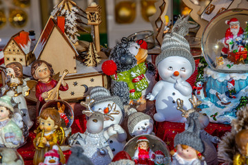 Variety of tiny Christmas figures in a market stand on a German Christmas market