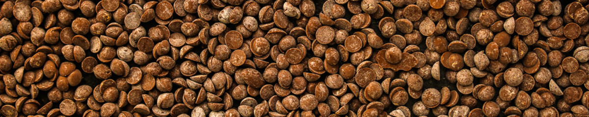 chocolate drops (black or milk chocolate, sweet ingredient) menu concept. food background. copy space. Top view