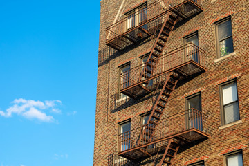 An Old Brick Residential Skyscraper with a Fire Escape in Astoria Queens New York