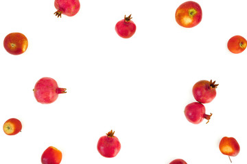 Pomegranate frame isolated on white background. Food background. Flat lay