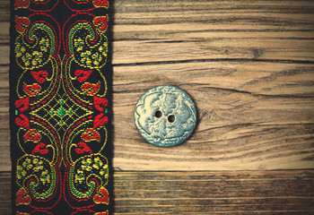 vintage band with embroidered ornaments and old button
