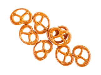 Salty snacks. Salt pretzels isolated on a white background. Top view.