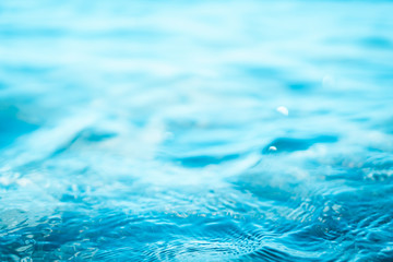 Blur tropical beach with bokeh sun light wave abstract background.