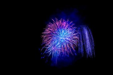 Beautiful colorful isolated firework display for celebration happy new year and merry christmas on black background