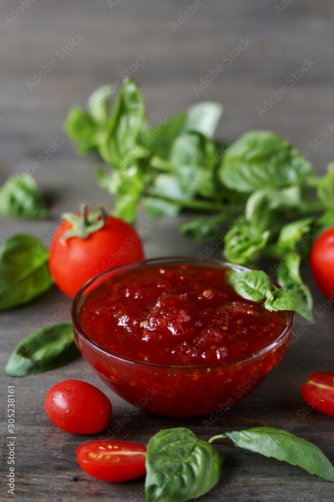 Sticker tomato jam or marmalade with basil. unusual jam. Turkish, French or Italian cuisine. copy space