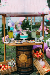 Cake with berries and fruits on a festively decorated table.Candy bar
