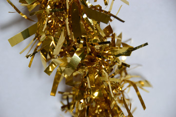 close up of shiny gold christmas tinsel