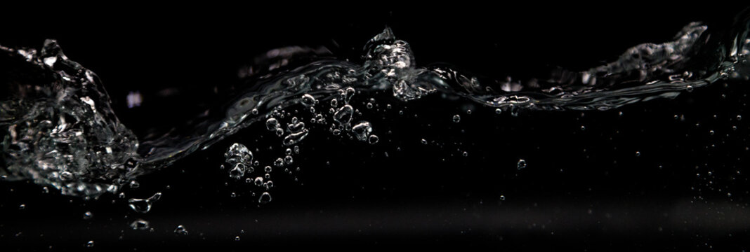 Water splashes on black background.