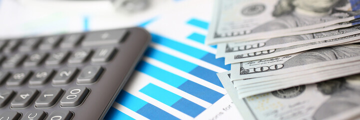 Silver calculator with gray keyboard is lying