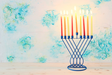 Religion image of jewish holiday Hanukkah background with menorah (traditional candelabra) and candles