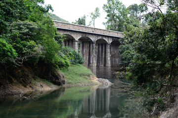 Bridge aqueduct with reflection,  Tam Tai reservoir Hong Kong 