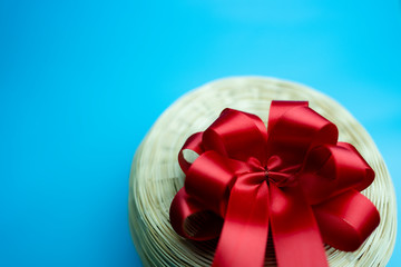 gift set collection : vintage round  bamboo basket with red satin ribbon bow on top 
