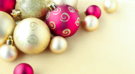 Christmas and New Year decoration. Red and gold balls on light background.
