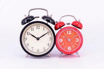 Alarm clock on white background. Selective focus.