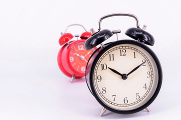 Alarm clock on white background. Selective focus.