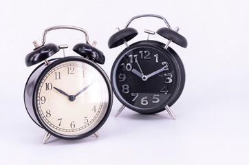 Alarm clock on white background. Selective focus.