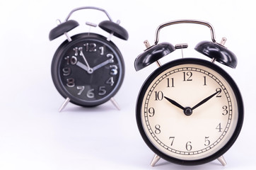 Alarm clock on white background. Selective focus.