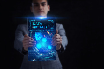 Business, Technology, Internet and network concept. Young businessman working on a virtual screen of the future and sees the inscription: Data breach