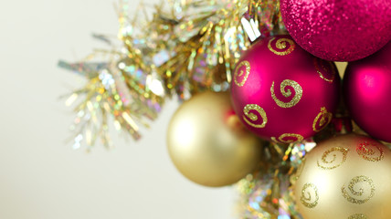 Christmas and New Year composition. Christmas red and gold balls and decoration on grey background
