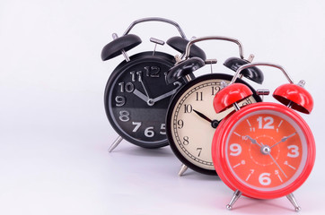 Alarm clock on white background. Selective focus.