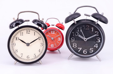 Alarm clock on white background. Selective focus.