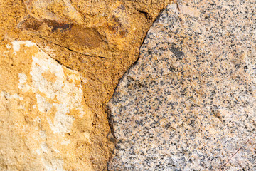 Fragment of a stone wall of granite and limestone.