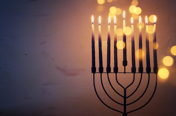Fototapeta na wymiar Religion image of jewish holiday Hanukkah background with menorah (traditional candelabra) and candles