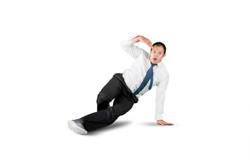 Businessman with break dancing move isolated over white