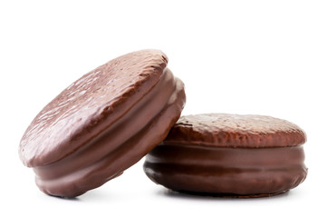Two cookies in chocolate choco pie closeup on a white. Isolated