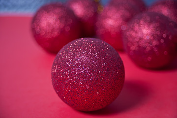 Red Christmas sparkle balls in a red background