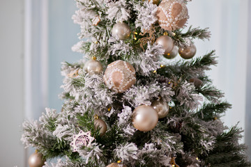 Decorated Christmas tree on light blue background