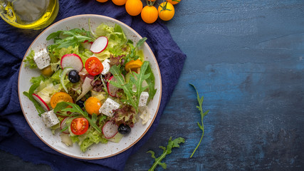 Vegetable salad on a plate. Delicious healthy food concept. Top view. Copy space