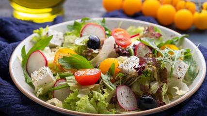 Vegetable salad on a plate. Delicious healthy food concept. Top view