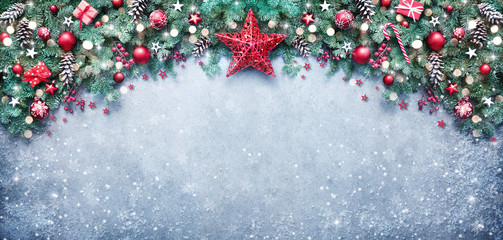 Christmas background with fir branches and holiday decoration