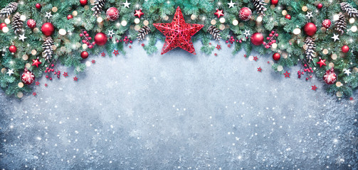 Christmas background with fir branches and holiday decoration